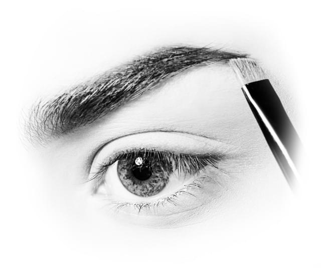 Brush applying eyebrow pomade